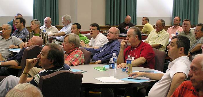 The group listening to the speaker